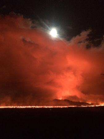 June 28 Night view of the lava channel toward fissure 8 under a nearly full moon.