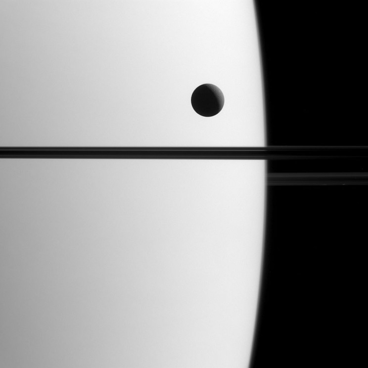 Saturn’s moon Dione crossed the face of the giant planet