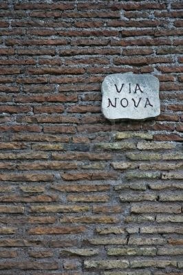 611333-ancient-roman-wall-with-street-nameboard